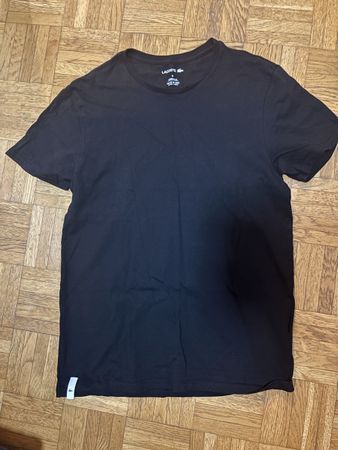T-shirt LACOSTE noir taille XS bon état