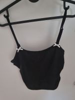 Schwarzes Crop Top mit Schleifen