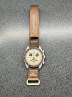 Swatch omega saturne