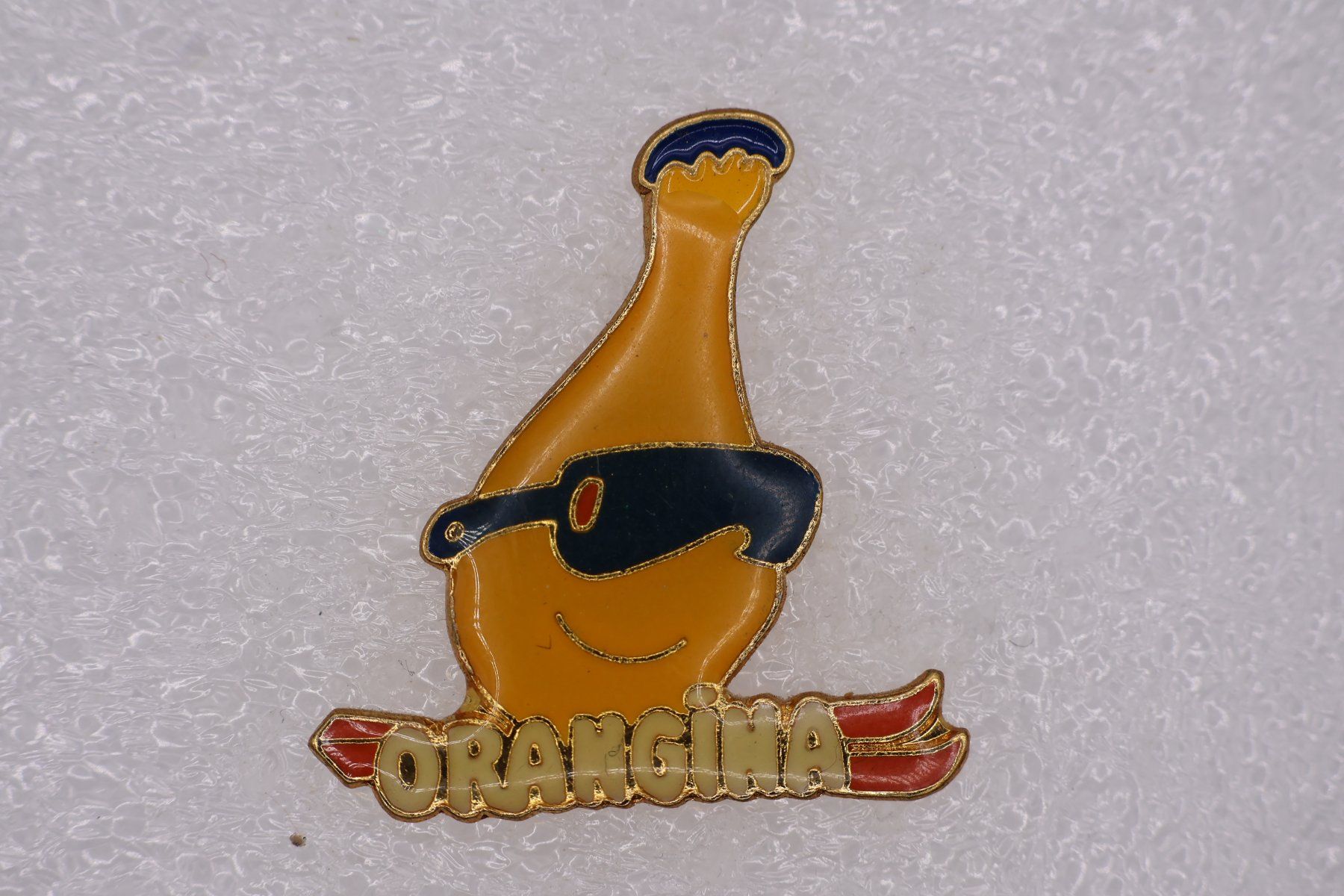 Placchette & Badge: ORANGINA – Usato da Winterthur venduto da Sammleroase