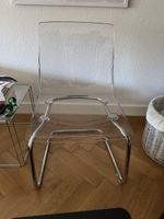 Transparent IKEA plastic chair with chrome frame