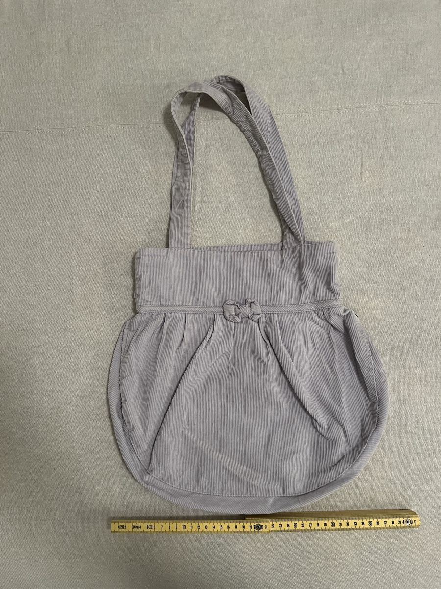 Borse da donna: Borsa Subdued con fiocco a coste lilla chiaro. – Usato da Mendrisio venduto da cost.del 1