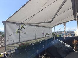 Store banne électrique Griesser 5x4 m avec volant abaissable