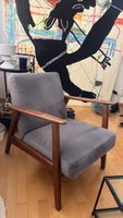 Blue velvet and wooden armchair