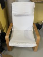 Ikea Poäng chair with white cushion cover