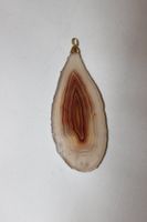 Pendentif en pierre polie