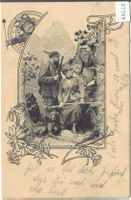 Jäger-Paar mit Hund in den Bergen