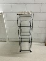 Stylish metal shelf with woven top, summer vibes!