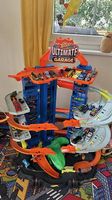 Hot Wheels City Megacity Parkgarage mit T-Rex-Angriff