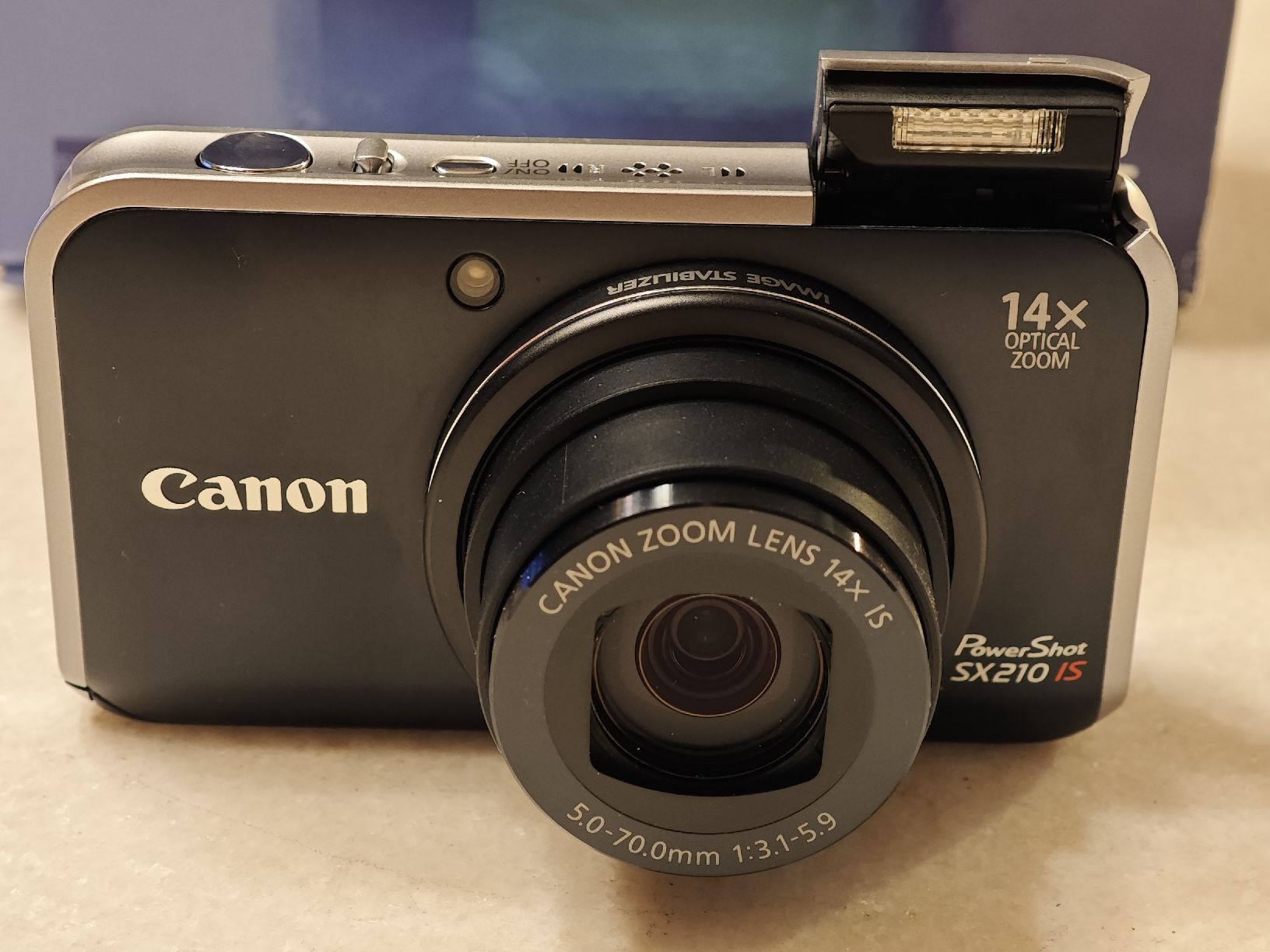 Canon Fotocamera: Canon PowerShot SX210 IS – Nuovo (secondo la descrizione) da Cham venduto da pot_lpv7