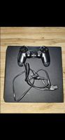 Console PlayStation 4 avec deux manettes et un cable d'alim
