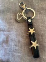 Sternen silberig/schwarzes Band / SCHLÜSSELANHÄNGER NEU/OVP