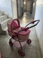 Puppenwagen rosa mit  Zubehör guter Zustand