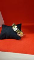 Goldfarbenes Armband mit geometrischem Muster, neuwertig