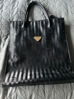 Sac à main noir Maison Mollerus, vintage et élégant.