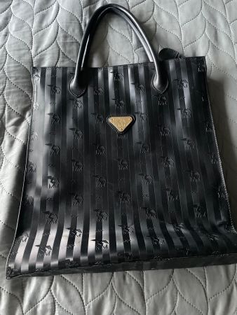 Sac à main noir Maison Mollerus, vintage et élégant.
