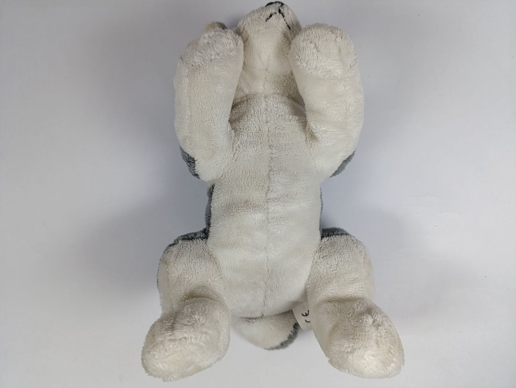 Migros Spielzeuge: MIGROS Peluche de chien gris et blanc – Gebraucht aus Thielle von Plusvalue_Neuchatel 2