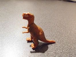 Dinosaurier orange/grün, auf zwei Beinen