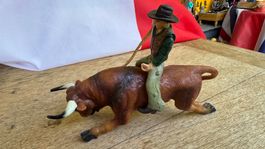 Cowboy auf einem Stier