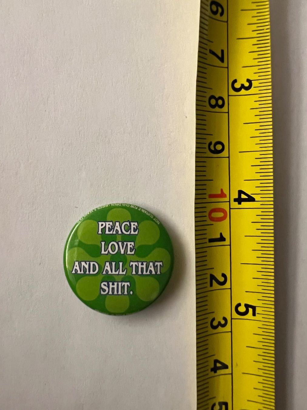 Spille & Fermagli: Button «Peace love and all that shit.» – Usato da Zürich venduto da rigani 1