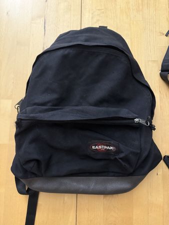 Black Eastpak bag with leather protection at the buttom