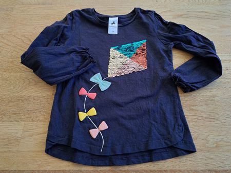 Langarmshirt mit Pailletten und Schleifen, Grösse 116