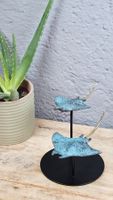 Duo de raies manta en bronze sur socle rond