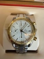 Montre Omega Speedmaster automatique acier et or 