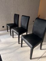 6 schwarze Esszimmerstühle – gepolstert