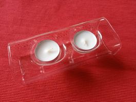 Glasdeko mit Kerzen