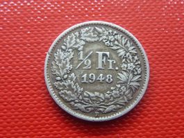 Abart Silber 1/2 Fr. 1948 mit 1 Blatt zu viel über 1/2