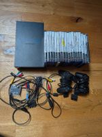 Playstation 2 mit diversen Spielen und Zubehör