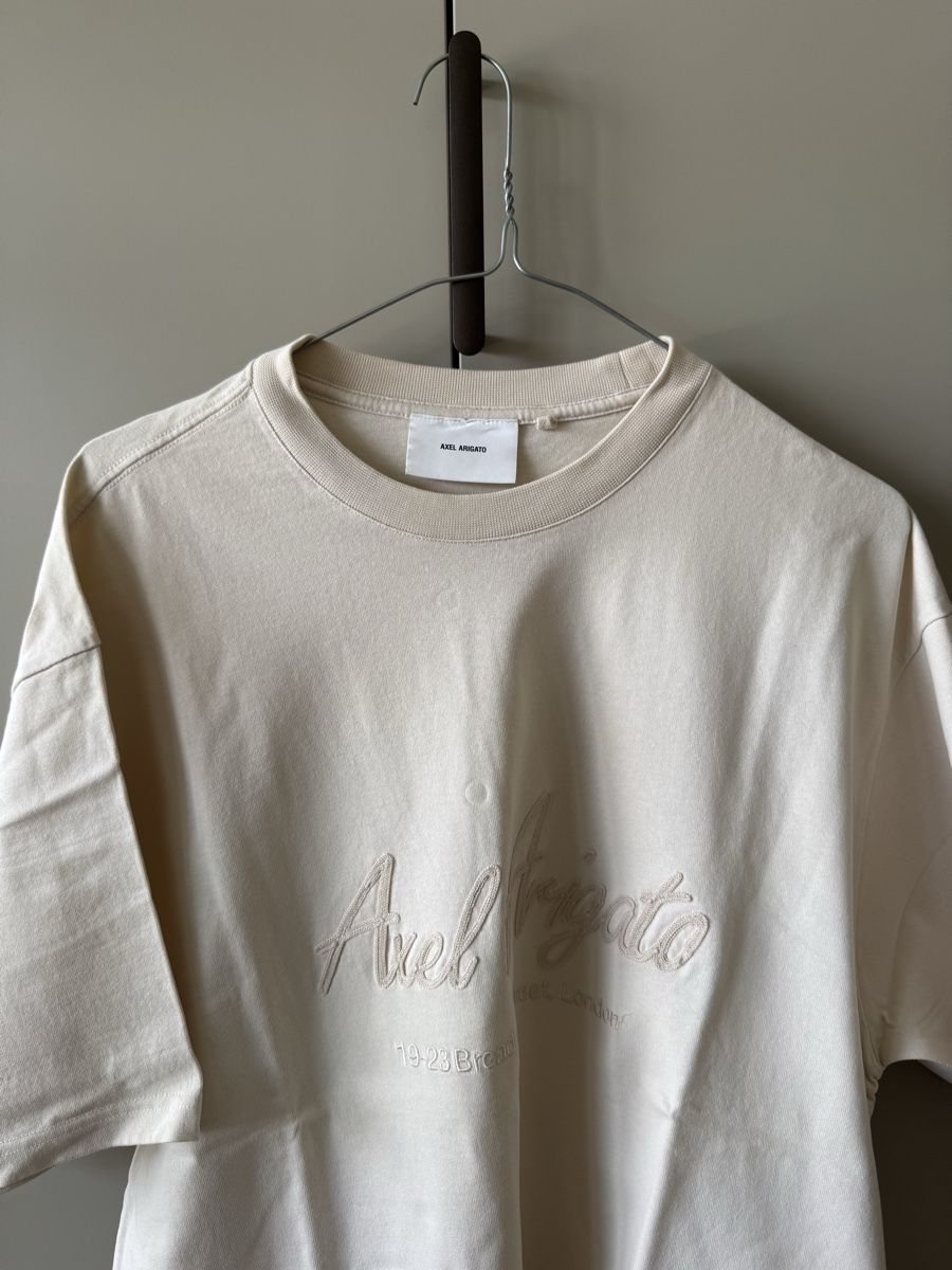 T-shirt: T-shirt Axel Arigato – Nuovo (secondo la descrizione) da Châtel-St-Denis venduto da Lou_Hock 1
