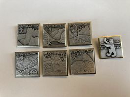 7 Alpenlauf-Pins 1974-1979 + Bär