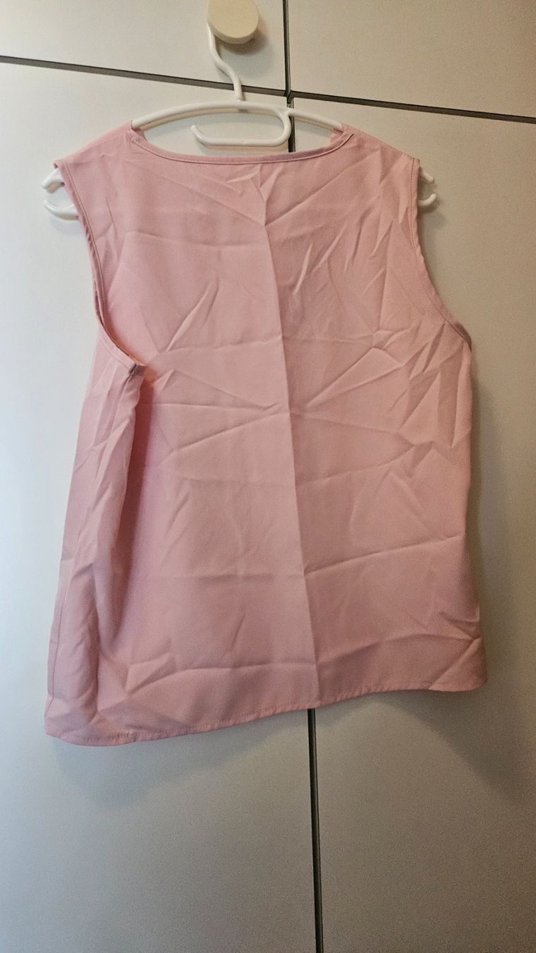 Top: Top canotta rosa chiaro tg.M poliestere – Usato da Melano venduto da H-Sara 1