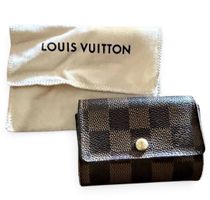 Portafoglio Louis Vuitton Damier Ebene, usato, con danni