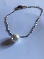 Magnifique bracelet argenté avec perle neuf
