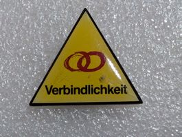 Ansteckpin 246: Verbindlichkeit