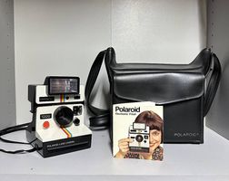 Polaroid 1000 Red + Flash + Borsa pelle + Libretto