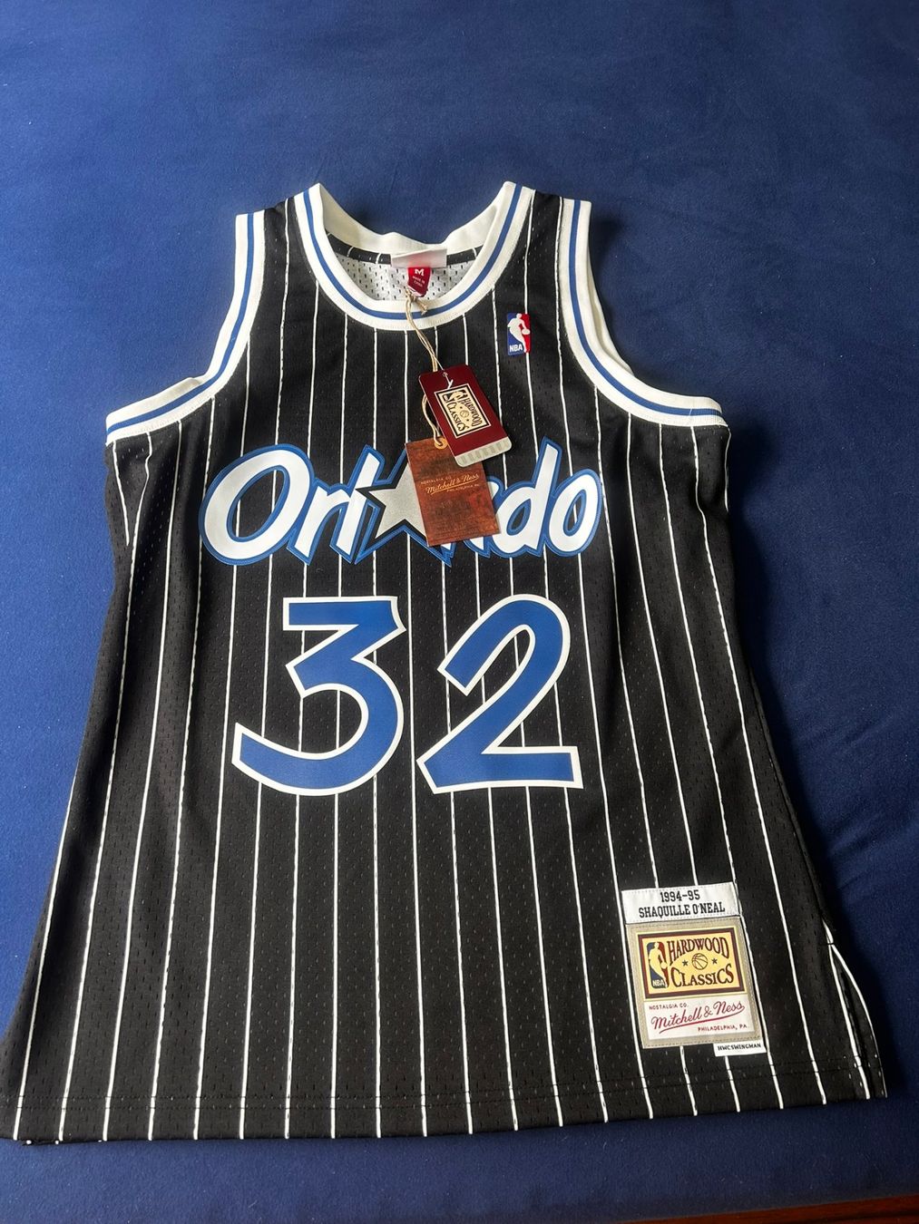 Mitchell & Ness Leibchen & Hosen: ORLANDO MAGIC - Trikot schwarz neu Gr. M – Neu und originalverpackt aus Thalwil von Mbadzi