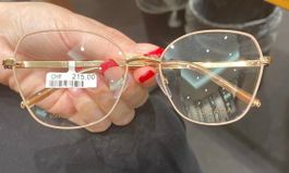 Occhiali marca Escada in acciaio oro