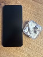 Smartphone NOTHING-Phone und Kopfhörer
