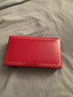 Cartier Coffret vide et pochon en tissu, rouge.
