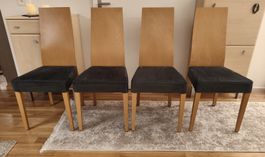 4 Holzstühle mit Dunkelblauen Bezügen in gutem Zustand.