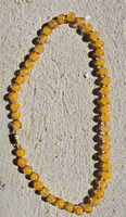 Collana di perle gialle effetto craquelé usato