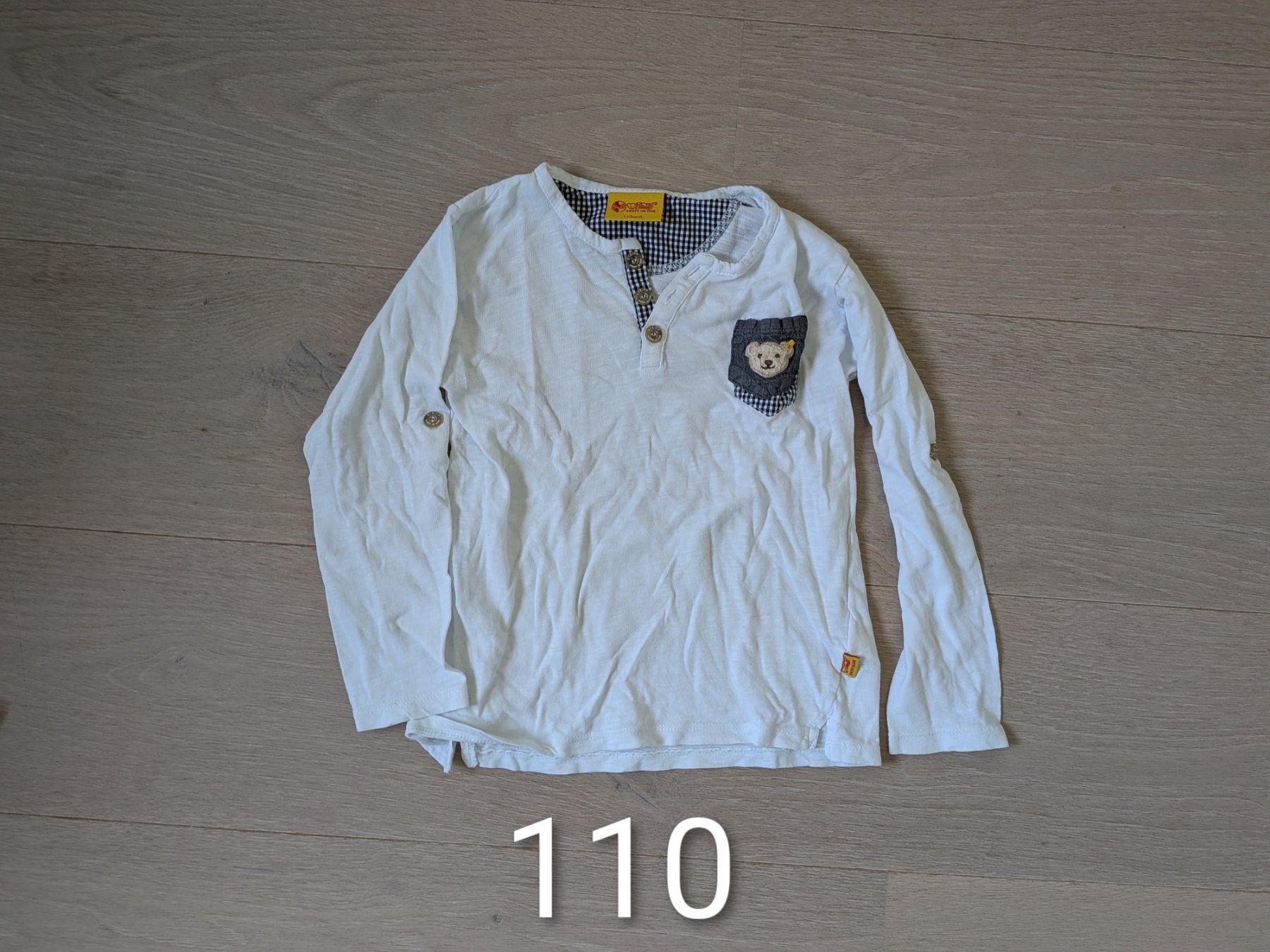 Steiff Maglioni & Felpe: Steiff Langarmshirt mit Teddy-Brusttasche | Gr. 110 – Nuovo (secondo la descrizione) da Appenzell-Steinegg venduto da AppenzellerIn