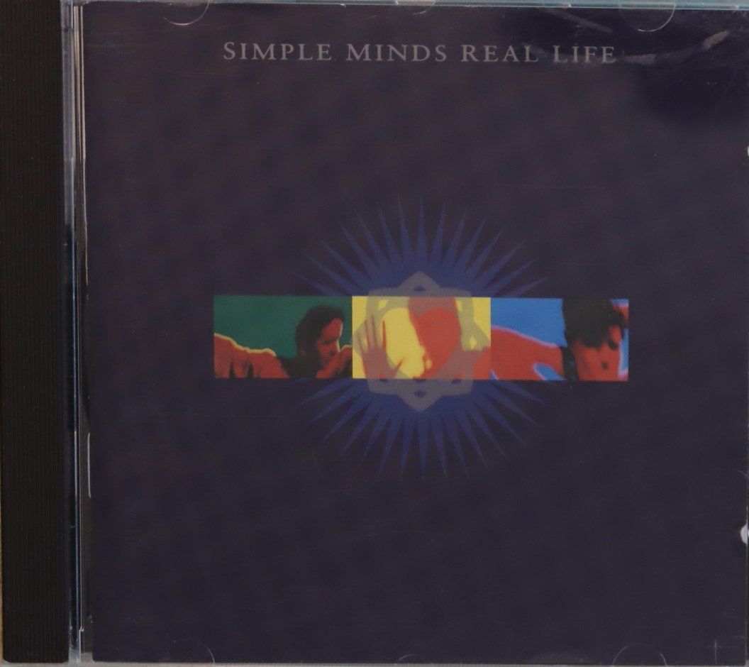 CDs: Simple Minds – Real Life – Gebraucht aus Luzern von CONTENTI