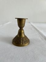 Tischglöckchen und Kerzenständer aus Messing