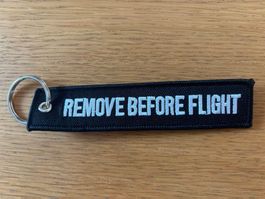 1 Schlüsselanhänger REMOVE BEFORE FLIGHT schwarz