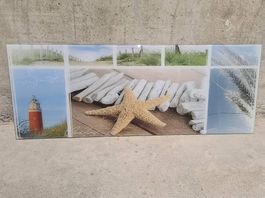 Glasbild Collage Meer, Leuchtturm, Sanddüne